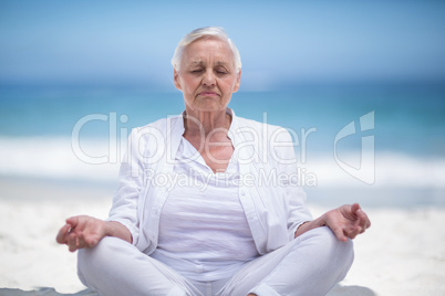 Beautiful mature woman meditating