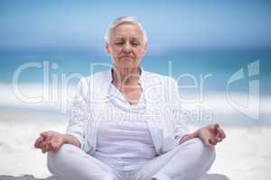 Beautiful mature woman meditating