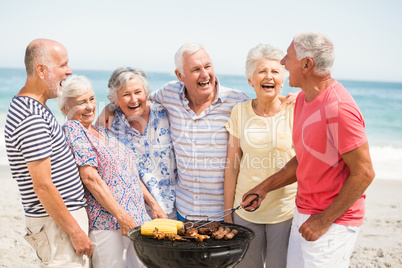 Senior having a barbecue on the beach