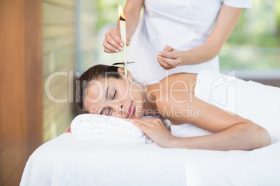 Close-up of beautiful woman receiving spa treatment