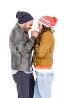 Young couple in warm cloth standing face to face and shivering