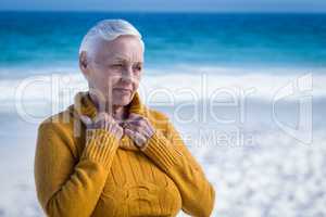 Thoughtful senior woman at the beach