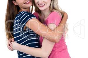 Happy female friends hugging