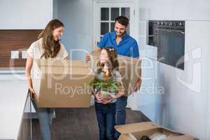 Smiling family moving house