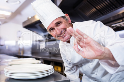Smiling chef showing ok sign