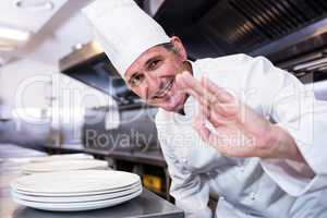 Smiling chef showing ok sign
