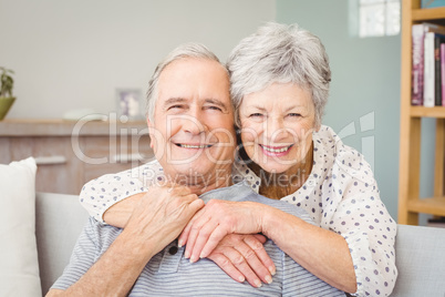 Portrait of romantic senior couple at home