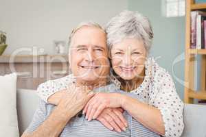 Portrait of romantic senior couple at home