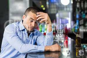 Depressed man having a whiskey