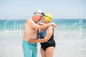 Senior couple with bathing cap at the beach