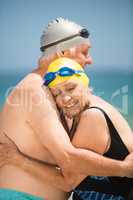 Senior couple hugging at the beach