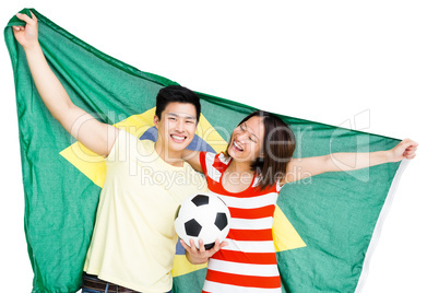 Couple holding brazil flag