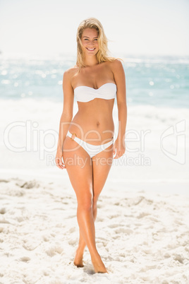 Smiling woman posing at the beach