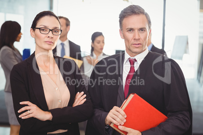 Businesswoman standing with lawyer