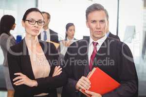 Businesswoman standing with lawyer