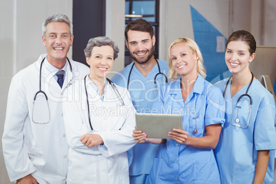 Portrait of cheerful doctor team with digital tablet