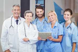 Portrait of cheerful doctor team with digital tablet
