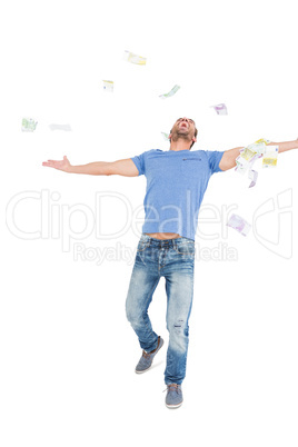 Young man throwing currency notes