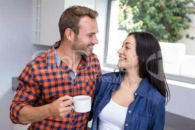 Couple having tea in the kitchen