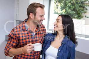 Couple having tea in the kitchen