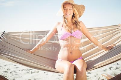 Woman sitting in hammock