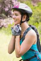 Smiling woman wearing a helmet