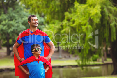 Father and son in superhero costume