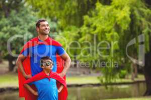 Father and son in superhero costume