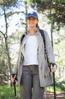 Smiling woman nordic walking