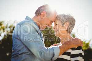 Side view of romantic senior couple looking at each other