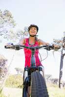 Smiling woman cycling