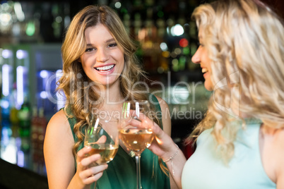 Happy friends having a drink