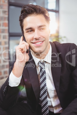 Close-up of businessman talking on mobile phone