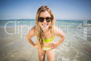 Portrait of happy woman standing on the beach