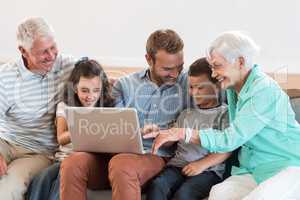 Happy family sitting on sofa