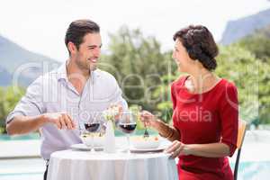Happy couple having food