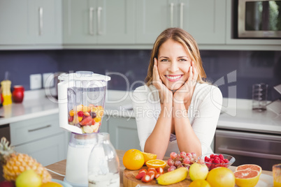 Portrait of smiling woman sitting at table