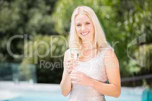 Portrait of smiling woman holding champagne flute