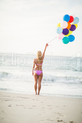 Beautiful woman holding balloon