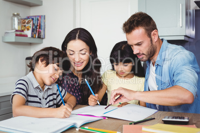 Parents assisting children doing homework