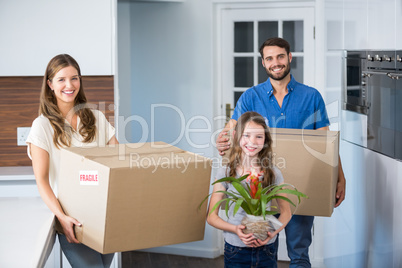 Portrait of family moving house
