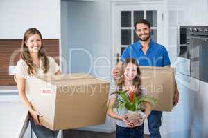 Portrait of family moving house