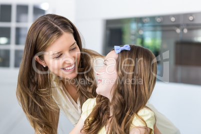 Mother and daughter looking face to face