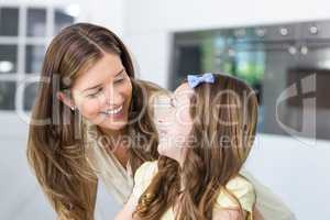 Mother and daughter looking face to face