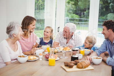 Happy multi-generation family having breakfast