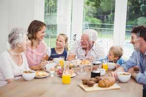 Happy multi-generation family having breakfast