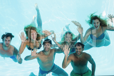 Group of young friends underwater