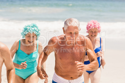 Senior friends running together