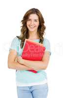 Portrait of young woman holding books