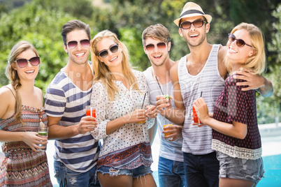 Group of happy friends having juice